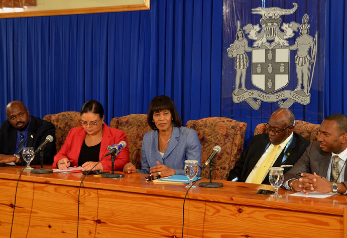 Prime Minister, the Most. Hon. Portia Simpson Miller (centre), addresses a press briefing held at the Office of the Prime Minister on October 9, to give an update on the national health emergency response. Others (from left) are: Acting Director General, Office of Disaster Preparedness and Emergency Management, Richard Thompson; Information Minister, Senator Hon. Sandrea Falconer; Minister of Health, Hon. Dr. Fenton Ferguson; and Acting Permanent Secretary in the Ministry of Health, Dr. Kevin Harvey (left).

