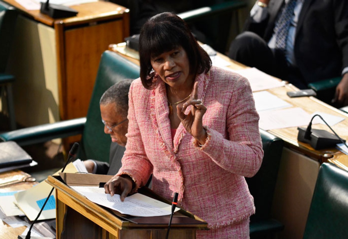 Prime Minister, the Most Hon. Portia Simpson Miller responds to questions about the revocation of the licence of EWI to construct a 381-megawatt energy plant during the sitting of the House of Representatives on Wednesday, June 4.