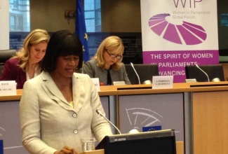 Prime Minister, the Most Hon. Portia Simpson Miller addressing the Women In Parliament Global Forum, held in the European Parliament in Brussels, Belgium, on November 27.