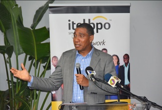 Prime Minister, the Most Hon. Andrew Holness, addresses itelbpo Smart Solutions’ fifth anniversary ceremony and grand opening of its Montego Bay Campus in Freeport, St. James, on October 4.