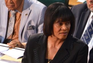 Prime Minister, the Most Hon. Portia Simpson Miller, pays tribute to late former President of South Africa, Nelson Mandela, during a joint sitting of Parliament on Friday, December 13. Mrs. Simpson Miller noted that Jamaica’s role in the anti-apartheid struggle is etched forever in history.