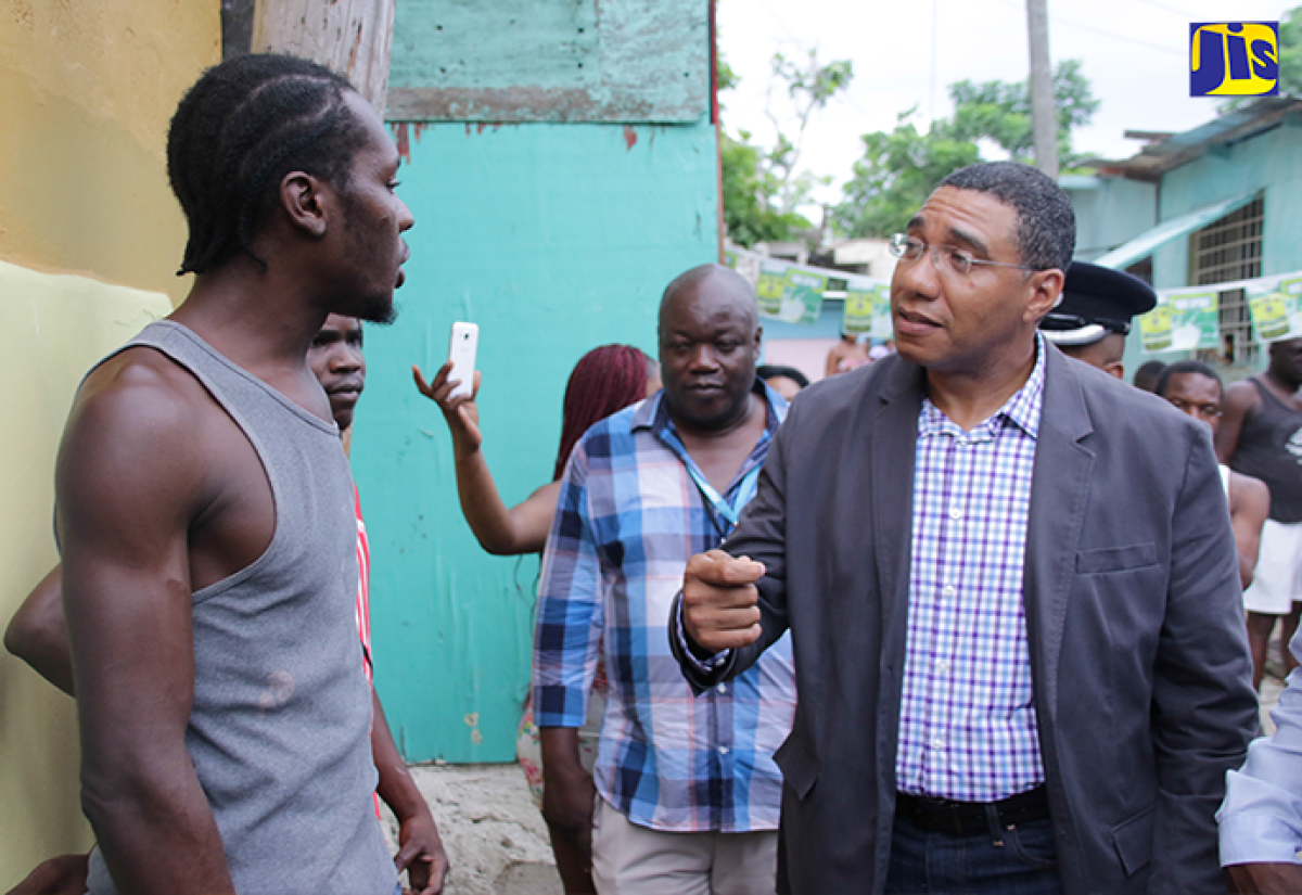 Prime Minister, the Most Hon. Andrew Holness (right), converses with a resident of Mount Salem, St. James, during a tour of the Zone of Special Operations (ZOSO) in that community on Sunday, September 3. Mr. Holness visited to get an update from the joint police/military command on activities in the ZOSO, which was declared on Friday, September l.
