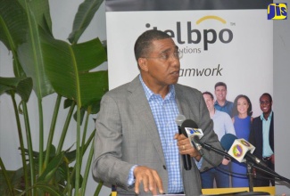 Prime Minister, the Most Hon. Andrew Holness, delivering the keynote address at itelbpo's fifth anniversary ceremony and grand opening of its facility in Freeport, St. James, on October 4.