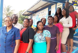 Principal of Woodford Primary and Infant School, Jennifer Gordon (2nd left, front row) with members of staff.