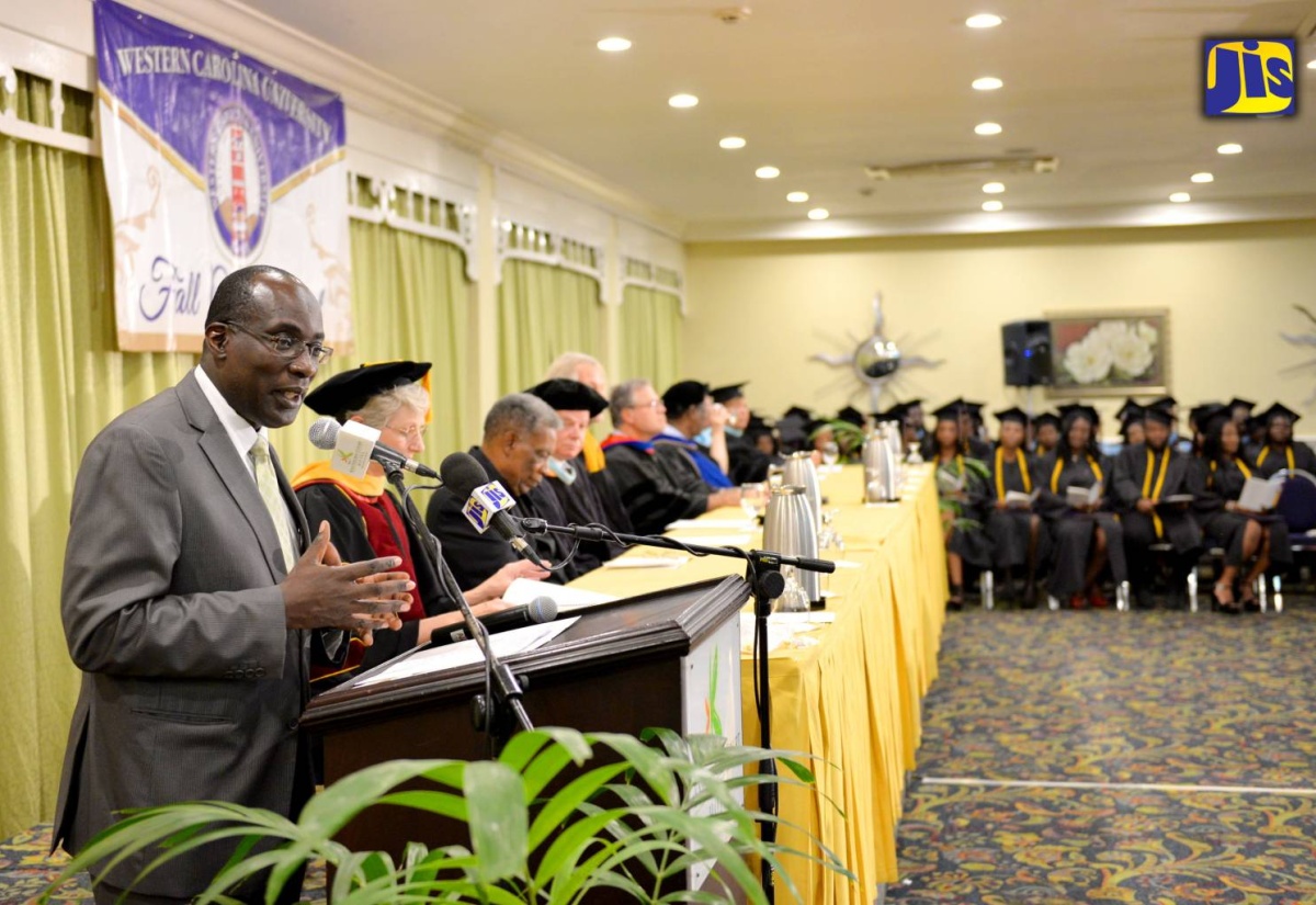 Education, Youth and Information Minister, Senator the Hon. Ruel Reid (left), addressing the audience at Western Carolina University's fall commencement, which was  held at the Knutsford Court Hotel in New Kingston on Friday, October 21.