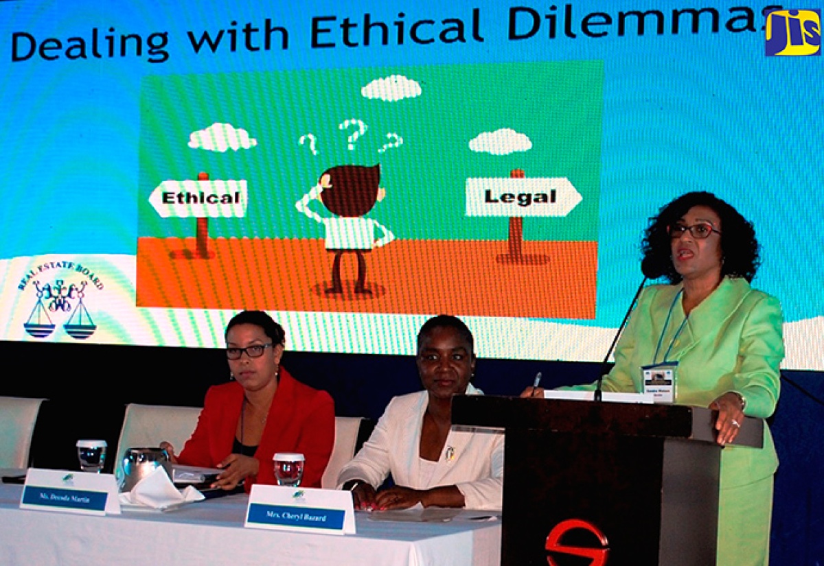 Chief Executive Officer of the Real Estate Board (REB), Sandra Watson Garrick (right), addresses the Annual Anti-Money Laundering/Counter-Financing of Terrorism (AML/CFT) Conference at the Spanish Court Hotel, recently.  Listening keenly are Director of the Financial Institute Supervisory Division, Bank of Jamaica, Decoda Martin (left); and Chair of the function and trainer and consultant, Bazard and Company, Cheryl Bazard.

