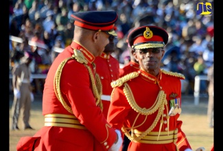 New Chief of Defence Staff, Major General Rocky Meade (right), is greeted by outgoing Chief of Defence Staff,  Major General Antony Anderson (left), at the Change of Command parade at Up Park Camp, on January 21.