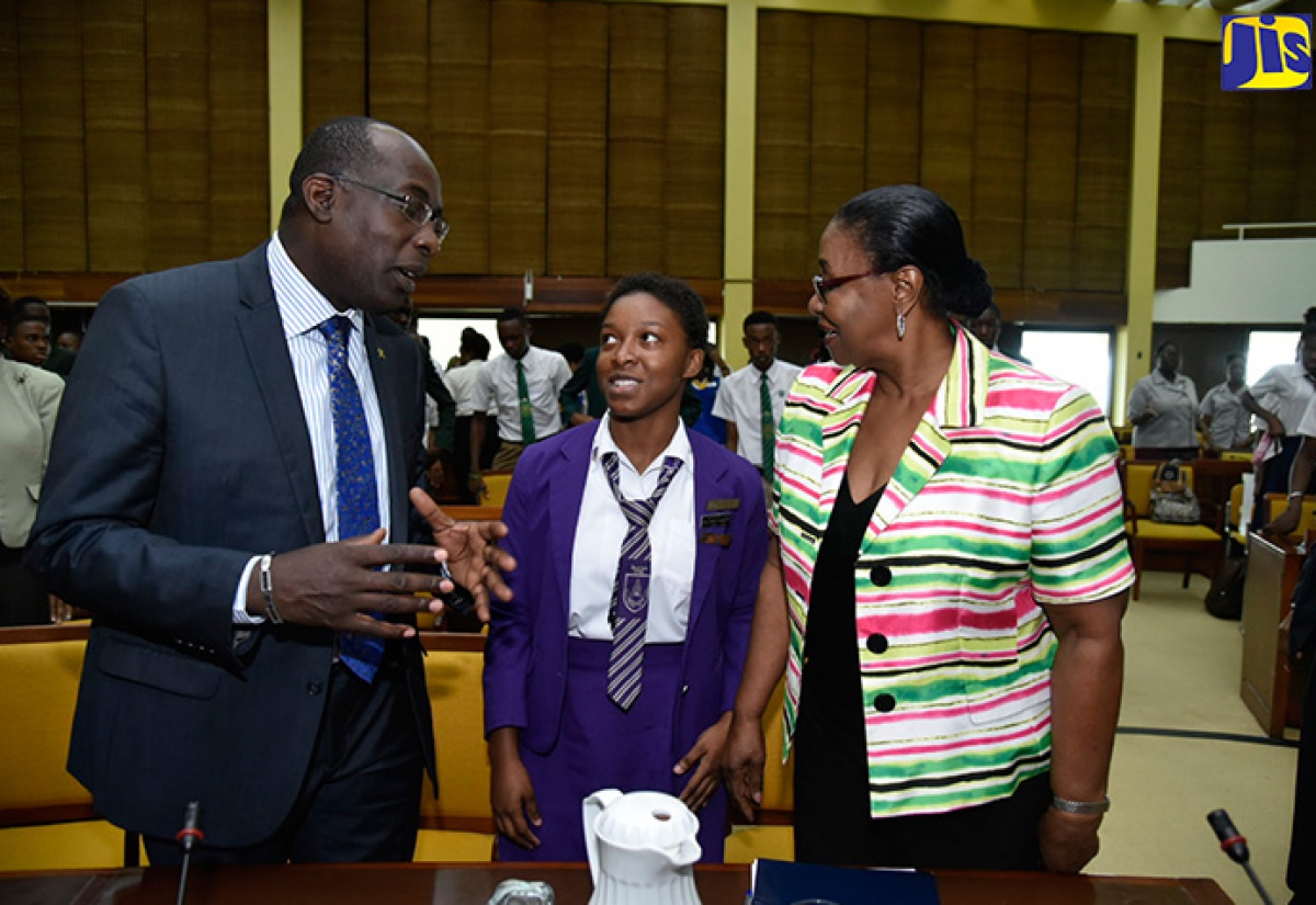 Minister of Education, Youth and Information, Senator the Hon. Ruel Reid (left) conversing with President, Jamaica Student Council Association, Antonette Dennis (centre); and Custos of St. Andrew and Co-Chair, Kingston and St. Andrew Development and Homecoming Foundation, Patricia Dunwell. Occasion was the official launch of the Student Motivational and Empowerment Programme at the Jamaica Conference Centre in downtown Kingston on November 2.