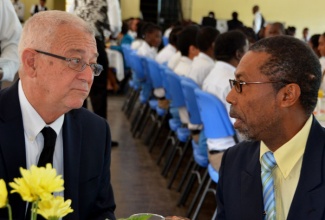 Minister of Education, Hon. Rev. Ronald Thwaites (left), is in discussion with Chaplain of the Ardenne High School, Rev. George Lewis, during the staging of the institution’s inaugural Distinguished Lecture Series 2013, at its location in St. Andrew on November 6.
