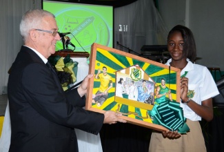 Minister of Education, Hon. Rev. Ronald Thwaites, receives a painting from student at the Belair High School in Manchester, Tijesunimi Adekeye, which was done by fellow student, Alexander Taylor. Occasion was the dedication and official opening of the institution on Wednesday, January 29.