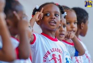 Mickayla Rhule of Future Leaders Care and Learning Centre (centre),  performs with her peers for those in attendance at the Early Childhood Commission’s back-to-school fair, held at Emancipation Park in New Kingston, on August 21.  (FILE)
