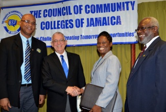 Education Minister, Hon. Rev. Ronald Thwaites (2nd left), shares a pleasant moment with (from left): Principal of Moneague College in St. Ann, Howard Isaacs; Executive Director Council of Community Colleges of Jamaica (CCCJ), Dr. Donna Powell-Watson; and Chairman, CCCJ, Quince Francis. Occasion was the CCCJ’s inaugural ‘Power Breakfast’ held on January7 at the Knutsford Court Hotel in New Kingston.
