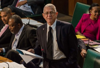 Minister of Education, Hon. Rev Ronald Thwaites, addresses the House of Representatives on Tuesday, October 14. The Ministry of Education will be implementing interim measures to regulate the tertiary education sector.