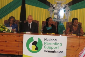 Executive Director, National Parenting Support Commission (NPSC), Dr. Patrece Charles-Freeman (right), updates the media on a number of activities to observe National Parent Month, during the official launch on the month and the NPSC held on November 1, at the Office of the Prime Minister. Listening (from left)  are: NPSC Chairman, Hon. Lady Hall; Education Minister, Hon. Rev. Ronald Thwaites; and Permanent Secretary, Ministry of Education, Elaine Foster-Allen.
