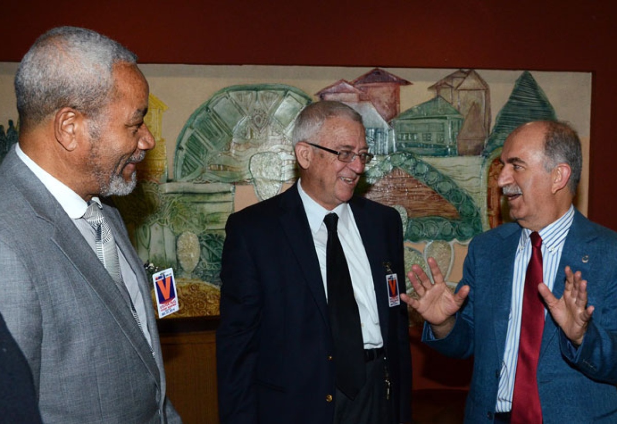 Minister of Education, Hon. Rev. Ronald Thwaites (centre), having a light discussion with  Governor of Bursa, a wealthy industrial province in Turkey, Sahabettin Harput (right),  on his arrival at the Norman Manley International Airport in Kingston on January  16.  At left is the Minister’s Senior Advisor, Dr. Franklin Johnston. The nine-member delegation from the Republic of Turkey is on a three-day mission, aimed at identifying a site for the construction of a private secondary school in Jamaica. 