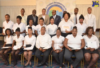 Prime Minister the Most Hon. Andrew Holness (3rd left back) with the 21 graduates of the Tourism Product Development Company (TPDCo) Culinary Skills Training Programme. The TPDCo spare headed initiative aims to upgrade the skills of new and existing entrepreneurs in the field of gastronomy. The graduation ceremony was held on March 1 at the Jamaica Pegasus Hotel in Kingston. Others pictured from (2nd left back) are Minister of Education, Youth and Information Senator the Hon. Ruel Reid and Minister of Tourism, Hon. Edmund Bartlett.