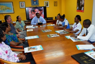 United Nation’s Children Fund (UNICEF) representative to Jamaica, Mark Connolly, (third left) speaks with members of the Child Development Agency’s (CDA) Children Advisory Panel during a courtesy call paid by the Panel on the UNICEF’s representative at his office in Knutsford Boulevard, Kingston, on Friday, March 14. Seated (from left) are: Secretary, Policy Planning and Evaluation, CDA, Jodian Givons; Children  Officer, CDA, Tahecia Salmon; Child Protection Specialist, UNICEF, Janet Cupidon-Quallo; Director, Policy Planning and Evaluation, CDA, Newton Douglas; Suzecka Swaby, Glenmuir High School, MayPen, Clarendon; Kinshasia Johnson, Merl Grove High School, Kingston; Meca-Gaye Francis, Campion College, Kingston; Shemar Millwood, Jamaica College, Kingston; Rushay Ximines, Meadowbrook High School, Kingston and Campion College student and Chairperson of CAP, Charles Young.