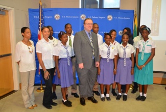 Public Affairs Officer, United States Embassy, Christopher Degnan (centre), shares a moment with Youth Ambassadors and their teachers, who will be participating in a cultural exchange in the United States in October. The group participated in a pre-departure briefing session on September 6 at the Embassy in Kingston.
