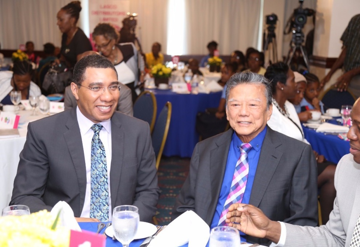 Prime Minister Andrew Holness shares a light moment with Executive Chairman and Founder of the LASCO Affiliated Companies, Lascelles Chin at the LASCO Releaf Environmental Awareness Programme (REAP) Awards Ceremony today (June 7). Also pictured is Senator the Hon. Pearnel Charles Jr. Minister of State in the Ministry of National Security.  