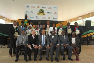 Governor General, His Excellency the Most Hon. Sir Patrick Allen (seated third from left), with the 13 recipients of the 2018 Governor General’s Achievement Awards (GGAA) for the County of Cornwall. The award ceremony was held at the Melia Braco Village in Trelwany on May 25. Also sharing the moment (seated from left) are Custos of Hanover, Dr. David Stair; Custos of Trelawny, Paul Muchette; Custos of Wetmoreland, Rev. Hartley Perrin; Custos of St. James, Bishop Conrad Pitkin; and Custos of St. Elizabeth, Beryl Rochester.