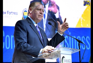 Minister of Industry, Commerce, Agriculture and Fisheries, Hon. Audley Shaw (right), in conversation with Chairman of Jamaica Promotions Corporation (JAMPRO), Senator Don Wehby, during the opening ceremony for the Jamaica Investment Forum (JIF) 2018, at the Iberostar Hotels and Resorts in St. James, on June 12.