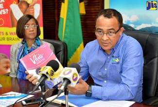 Health Minister, Dr. the Hon. Christopher Tufton, addresses journalists at a post-Sectoral Debate press briefing at the Ministry’s New Kingston head office on Wednesday (June 6). Looking on is Permanent Secretary in the Ministry, Sancia Templer.