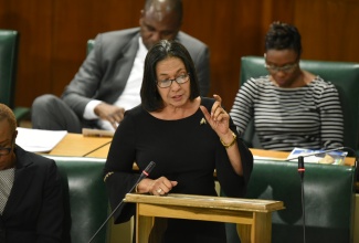 Minister of Labour and Social Security, Hon. Shahine Robinson, emphasies a point during her contribution to the 2018/19 Sectoral Debate in the House of Representatives on June 26.