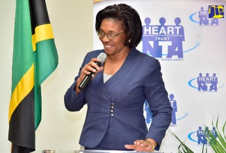 Managing Director of the HEART Trust/ NTA, Dr. Janet Dyer, addresses cheque presentation ceremony for $6 million donated by the Phillip & Christina Gore Family Foundation, in support of unattached youth in St. James and St. Catherine. The money  will be used to pay the stipend of 50 participants in the Housing, Opportunity, Production and Employment (HOPE) Programme. They will be working as interns with Gore Developments Limited. The cheque presentation ceremony was held on June 26 at the training institution’s corporate offices on Oxford Road in Kingston.