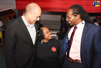 State Minister in the Ministry of Culture, Gender, Entertainment and Sport, Hon. Alando Terrelonge (right), and Board Chairman, Special Olympics Jamaica, Aldrick “Allie” McNab (left), congratulate 2018 National Summer Games gold medallist, Shereen Gordon, after she won her event at the Independence Park multipurpose court in Kingston on June 29. Messrs. Terrelonge and McNab attended the opening ceremony for the two-day event, which concluded on June 30.