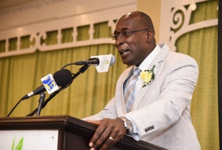 Minister of Education, Youth and Information, Senator the Hon. Ruel Reid, addresses the Ministry’s Region Six appreciation banquet for retired principals and launch of the School Improvement Support Initiative, at The Knutsford Court Hotel in Kingston on July 12.