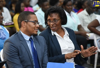 State Minister for Education, Youth and Information, Hon. Floyd Green (left), listens to Managing Director of the HEART Trust/NTA, Janet Dyer, during the opening ceremony of World Youth Skills Day 2018 Skills and Career Exposition on July 17 at the Garmex HEART Academy in Kingston. It was staged under the theme: ‘New Skills for Emerging Jobs: Improving the Image of Technical and Vocational Education and Training (TVET)’. 