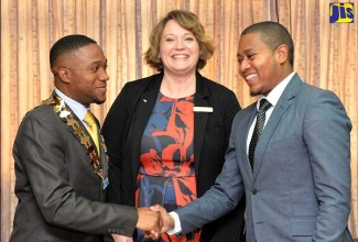 Minister of State in the Ministry of Education,  Youth and Information,  Hon. Floyd Green (right), welcomes President, Junior Chamber International (JCI), Jamaica, Dwayne Gayle (left), when he called on him at the Ministry, National Heroes Circle,  Kingston, on Friday (July 27).  At centre is Vice President, JCI, Rhonda Anderson. The JCI is an international non-profit organisation that creates an atmosphere within which young people between 18 and 40 years of age can develop their leadership skills. The JCI movement also seeks to provide development opportunities that empower young people to create positive changes in society. 