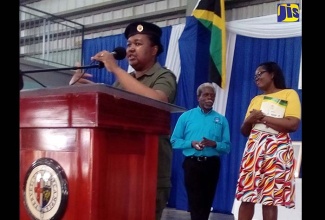 Chief Education Officer, Ministry of Education, Youth and Information, Dr. Grace McLean, addresses the National Parent-Teacher Association of Jamaica's (NPTAJ) Sixth Biennial General Meeting and National Conference at Jamaica College held in St. Andrew recently. In the backgrond are President of the NPTAJ, Everton Hannam; and Manager of the Student Assessment Unit in the Ministry, Terry-Ann Thomas Gayle.