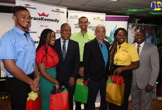 State Minister in the Ministry of Foreign Affairs and Foreign Trade, Senator the Hon. Pearnel Charles Jr. (right); Group Chief Executive Officer (CEO) of GraceKennedy Limited, Senator Don Wehby (third right); and Chairman of the Board of GraceKennedy Limited, Professor Gordon Shirley (third left), with GraceKennedy Jamaican Birthright Programme interns at the launch of the programme, held at GraceKennedy Limited, downtown Kingston, on July 2.  Interns (from left) are Joshua Tulloch, Kayla Green, Keenan Nembhard, and Anastacia Davis. 