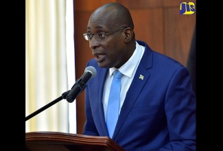 Minister of Education, Youth and Information, Senator the Hon. Ruel Reid, speaks at yesterday’s (July 11) post-Cabinet press briefing at Jamaica House. 