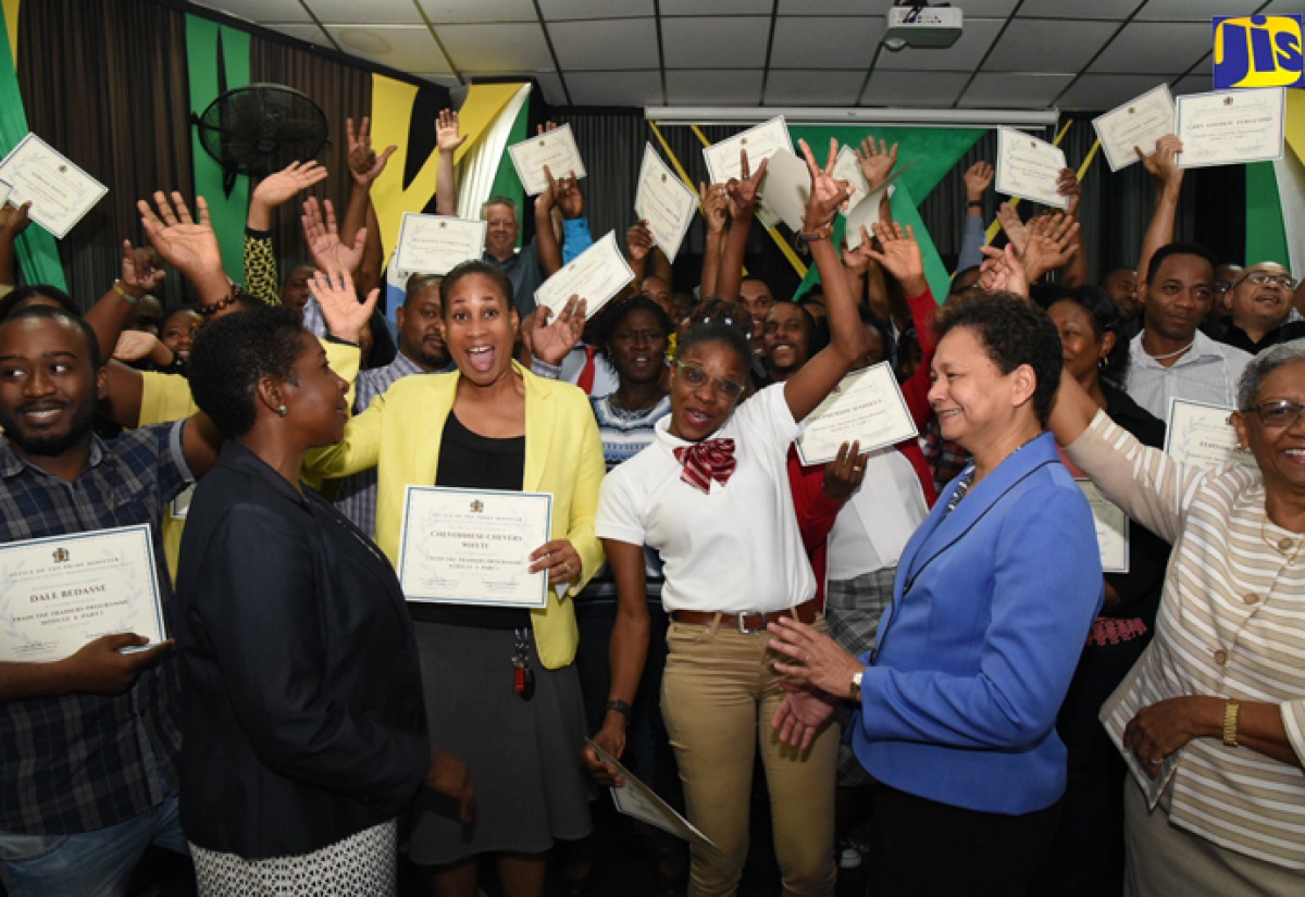 Principal Finance Officer at the Office of the Prime Minister (OPM), Rosalie Phipps (2nd right), along with Co-Task Team Leader at the World Bank, Karlene Francis (2nd left), and Project Manager for the OPM Youth Employment in the Digital and Animation Industries (YEDAI) Project, Margery Newland (right), celebrate with animation instructors at the closing ceremony for YEDAI's 'Train the Trainers' course held on (July 27) at the Excelsior Community College in Kingston. Fifty animation instructors participated in the training. 