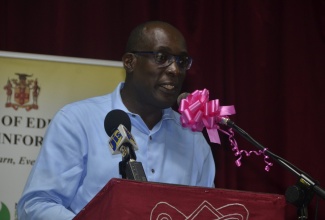 Education, Youth, and Information Minister, Senator the Hon. Ruel Reid, addressing stakeholders during the Ministry’s sensitization session at the Montego Bay High School Auditorium in St. James on Thursday (August 23).  