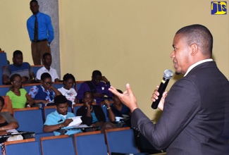 Minister of State in the Ministry of Education, Youth and Information, Hon. Floyd Green, addresses an information session hosted by the University of the Commonwealth Caribbean (UCC) at its Worthington Avenue premises in St. Andrew on August 7.