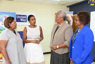 Board Chairman of United Way of Jamaica, Dr. Marcia Forbes (left), in conversation with (from second left): Chairperson of the Early Childhood Commission (ECC), Trisha Williams-Singh; Chief Executive Officer, United Way of Jamaica,  Winsome Wilkins; and Executive Director of the ECC, Karlene Deslandes, at a ceremony held at the offices of the National Volunteer Centre, Camp Road, in Kingston, on August 16.