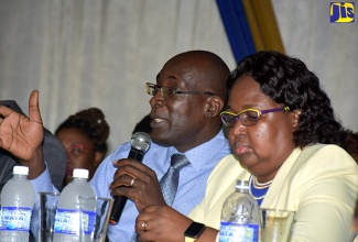 Minister of Education, Youth and Information, Senator the Hon. Ruel Reid (left), and Chief Education Officer, Dr. Grace McLean, at a parent sensitisation Session on August 16 at Merl Grove High School in Kingston.  The session, which covered Regions One and Two, was the first of several organised by the Ministry, with the objectives of informing parents on critical matters relating to educational policy initiatives, and to increase parent involvement in their children’s learning. 