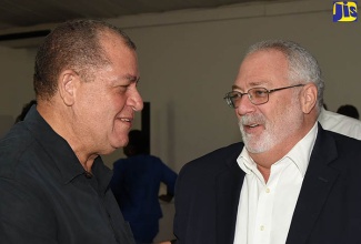 Minister of Industry, Commerce, Agriculture and Fisheries, Hon. Audley Shaw (left), in discussion with Chairman, Sugar Industry Authority (SIA), Phillip Henriques, at a luncheon hosted by the All-Island Jamaica Cane Farmers’ Association at the Spanish Court Hotel in New Kingston on Tuesday (September 4).