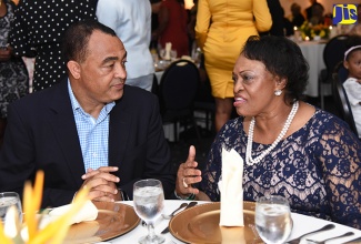 Health Minister, Dr. the Hon. Christopher Tufton (left), converses with Bishop Jacqueline McCullough of the WordAlive Medical Mission. They were at the ‘Make Jamaica Well Again’ Appreciation Dinner and Awards Ceremony, organised by WordAlive Medical Mission, which was held at The Jamaica Pegasus hotel, New Kingston, on Thursday (August 30).