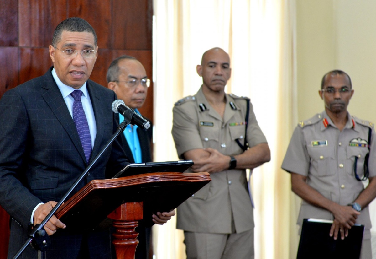 (SOE1) Prime Minister, the Most Andrew Holness (left), addresses a media briefing on Sunday (Sept. 23), to announce a State of Public Emergency (SOE) for sections of the Kingston Central, Kingston Western, and St. Andrew South Police Divisions. The briefing was held at the Office of the Prime Minister. Listening (from 2nd left) are: Minister of National Security, Hon. Dr. Horace Chang; Police Commissioner, Major General Antony Anderson; and Chief of Defence Staff, Major General Rocky Meade.