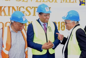 Prime Minister, the Most Hon. Andrew Holness (centre), engages in light banter with (from left) Leader of the Opposition, and Member of Parliament for St. Andrew East Central, Dr. Peter Phillips; and Minister without Portfolio in the Ministry of Economic Growth and Job Creation, Hon. Karl Samuda. Occasion was the ceremony to break ground for the $860-million Maxfield Park Development Project at the project site along Ricketts Crescent on Wednesday (October 3).  