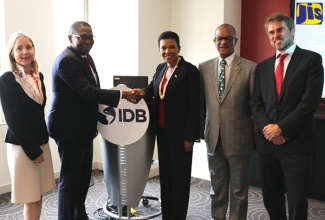 Jamaica’s Ambassador to the United States and Chairman of the CARICOM Caucus of Ambassadors, Her Excellency Audrey Marks (third right), congratulates newly appointed Inter-American Development Bank Executive Director for the Caribbean, Ambassador Selwin Hart (second left), after a luncheon at the IDB headquarters in Washington DC on Friday (October 19). Others (from left) are Manager of IDB Multilateral Invest Fund, Irene Arias-Hoffman; Jamaica’s representative to the IDB, Arthur Williams; and General Manager of IDB Invest, James Scriven.