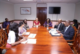 Mrs Audrey Sewell, Permanent Secretary in the Ministry of Economic Growth and Job Creation and the Office of the Prime Minister (centre right) met with the management of the National Works Agency, China Harbour Engineering Company and Mrs Collette Roberts Risden, Permanent Secretary, Ministry of Labour and Social Security (centre left) yesterday (October 3) to discuss the current work stoppage on the Mandela Highway Improvement Project. 
 
