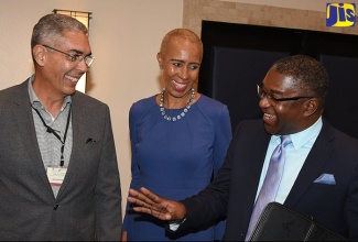 Minister without Portfolio in the Ministry of Finance and the Public Service, Hon. Fayval Williams (centre), engages with Bustamante Industrial Trade Union (BITU) President, Senator Kavan Gayle (right); and Sagicor Chairman, Richard Byles, at the 2018 Productivity and Continuous Improvement Conference hosted by Make Your Mark Consultants (MYMC), at The Jamaica Pegasus hotel in New Kingston on October 24. 