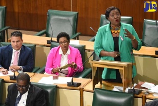 (FILE Photo) Government Senator Kerensia Morrison (standing) highlights a point while opening the State of the Nation debate in the Senate on Friday (October 26). Other Government Senators pictured (seated from left, second row) are: Matthew Samuda; and Dr. Saphire Longmore. In the front row is Senator Ransford Braham.