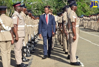 Minister of Finance and the Public Service, Dr. the Hon. Nigel Clarke, inspecting recruits trained under the Jamaica National Service Corps (JNSC), at the passing out parade held on October 20 at the Jamaica Defence Force's (JDF) Moneague training camp in St. Ann.