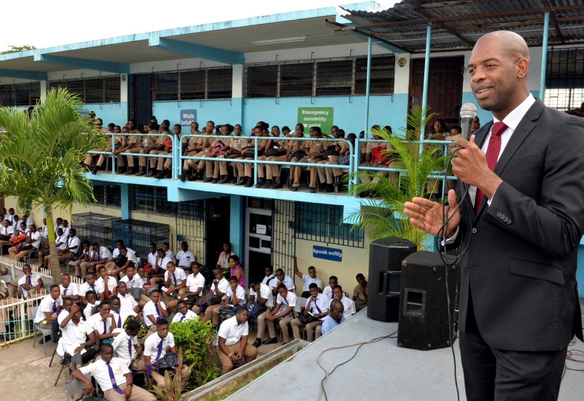 Senior Advisor in the Ministry of Industry, Commerce, Agriculture and Fisheries, Robert Miller, addresses the audience at the St. Catherine-based Enid Bennett High School on Boys’ Day, held at the institution on October 30.